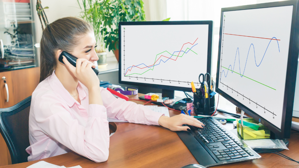 photo of a woman monitoring computer charts