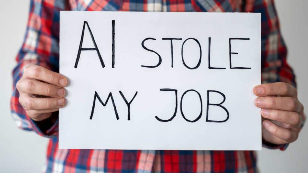 AI automation impacted person holding a placard